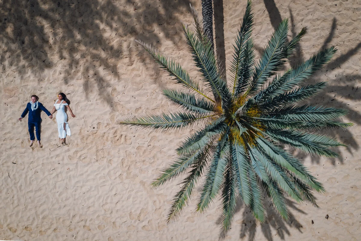 Drone Photo of a Couple on Sunset Beach, Oahu