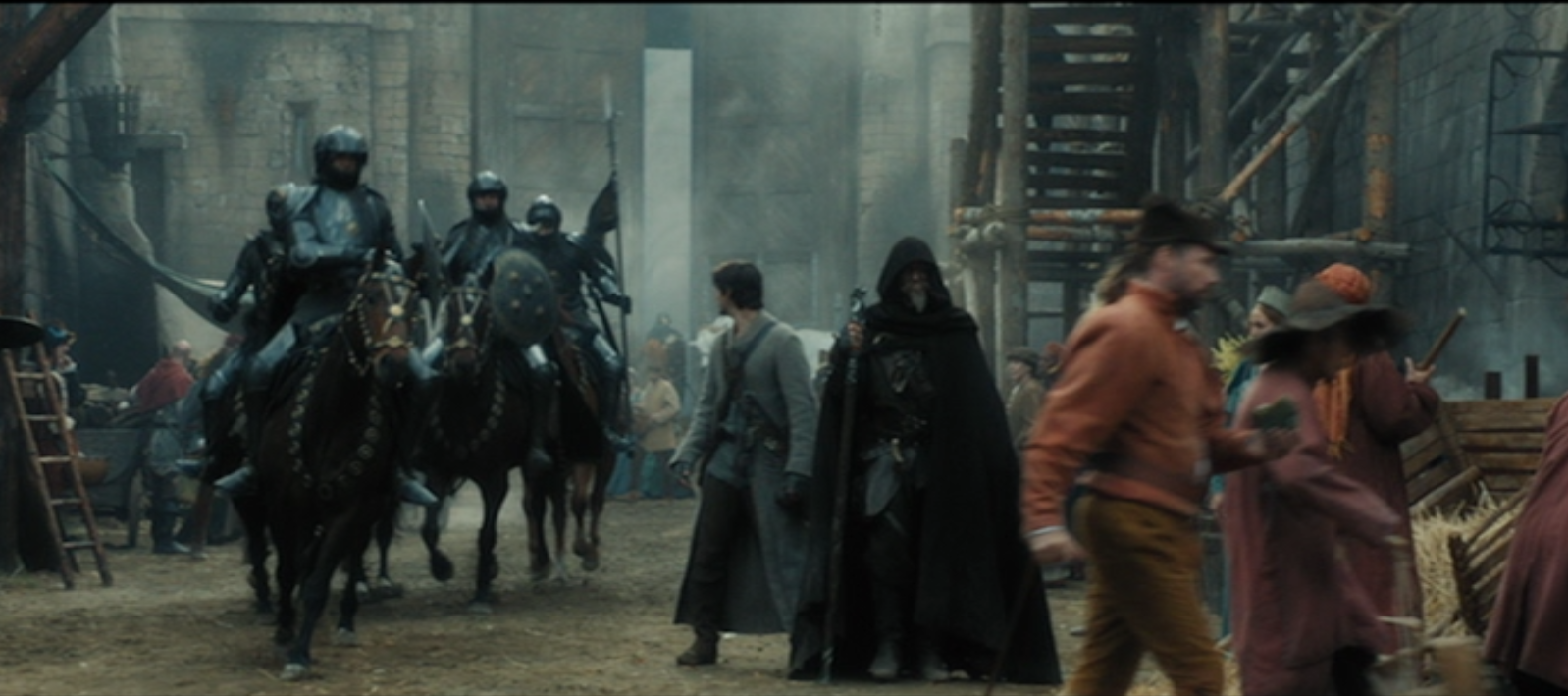 Main characters spotted between men in metal suits and red shirts..