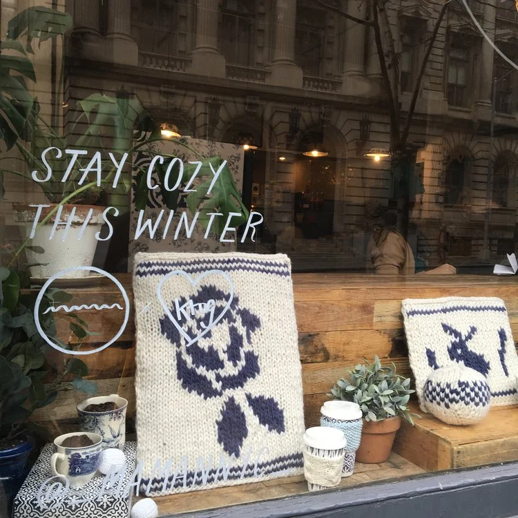 Karen illustrates beautiful floral designs, and we've always thought it would be fun to translate her drawings into knit work. She drew some floral and bunny shapes that we used for color work panels in the Soho window.