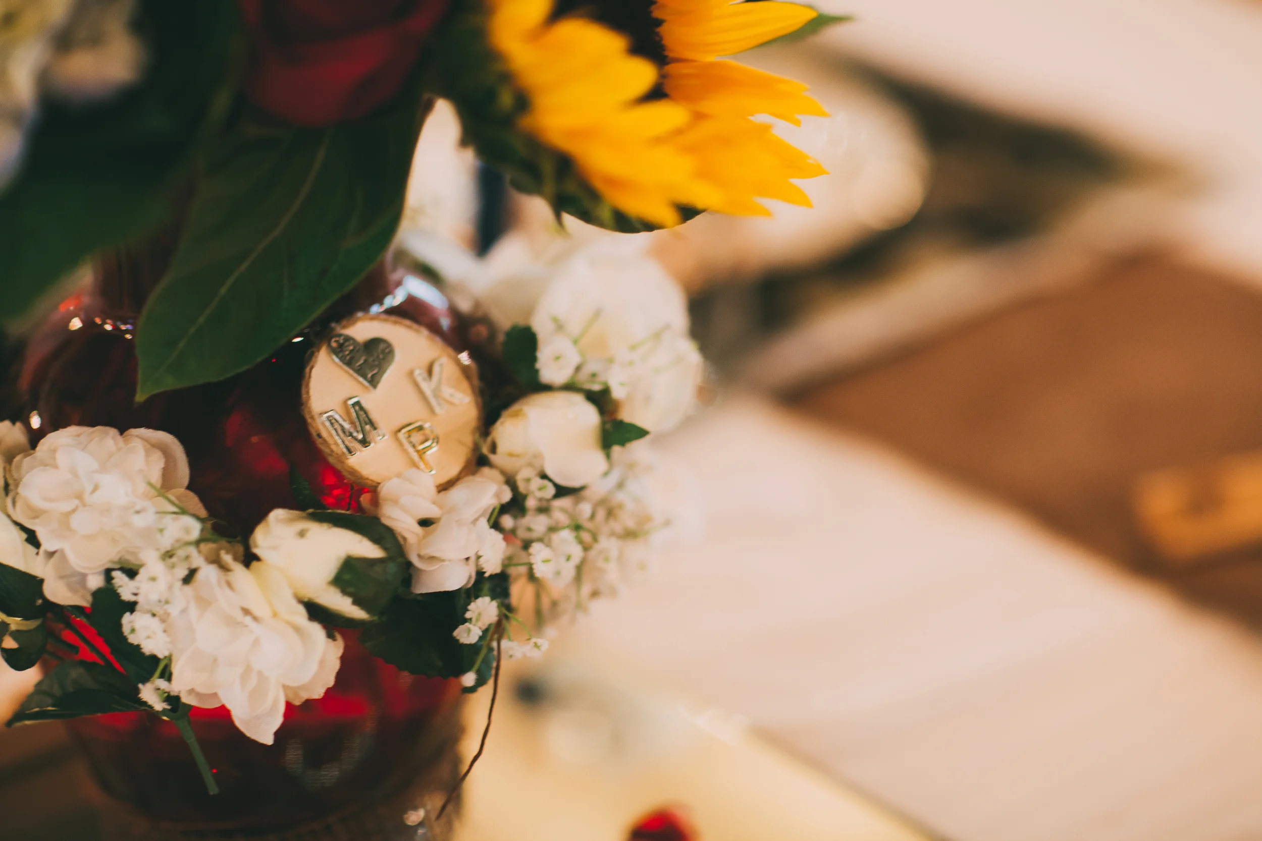 Each table had a unique centerpiece and different types of flowers - some with song lyrics to country love songs. Most of the arrangements had their initials on them. 