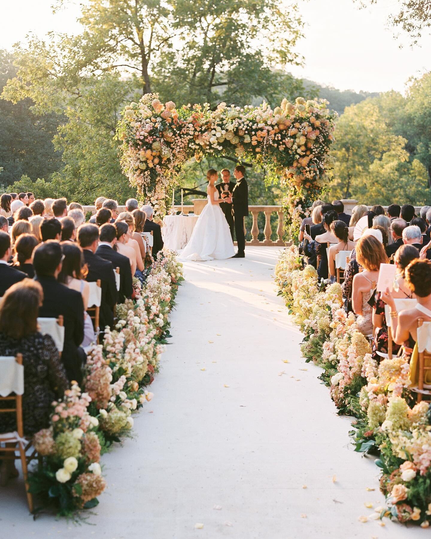 Exchanging vows in the privacy of your own backyard might be a dream come true. It was incredibly important to the bride and groom that their guests not only witnessed the exchange of vows but also felt intimately connected. We designed a structure w