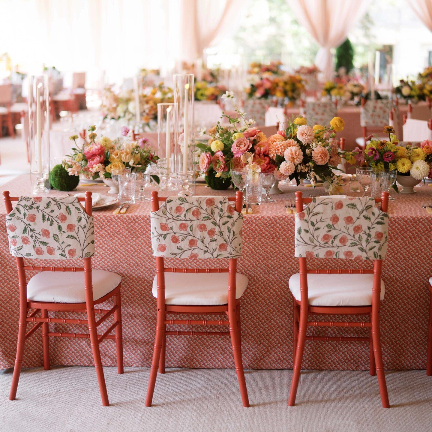 This once empty tent was magically transformed into a tailored expression of our bride and groom's warmth. Upholstered banquettes, backed with an explosion of fresh &quot;growing&quot; floral lined the walls, creating a cozy intimate atmosphere. One 