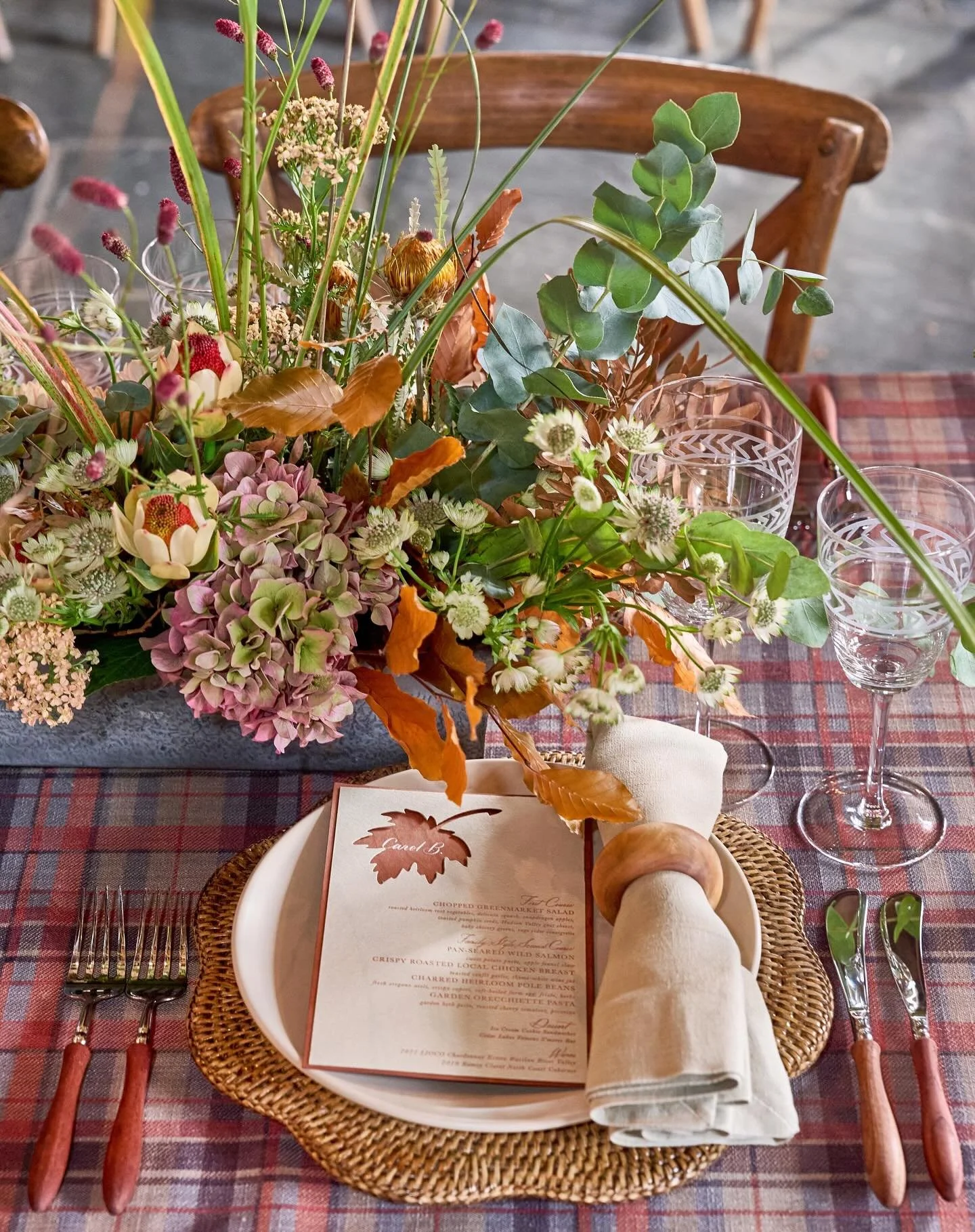 COZY was the direction for Christina and Chris&rsquo;s welcome party! 
Inside the pavilion, we draped the walls  with a thick plaid fabric that met up halfway with a large stacked wood pile, creating a warm, enclosed feel.

Plaid blankets were rolled