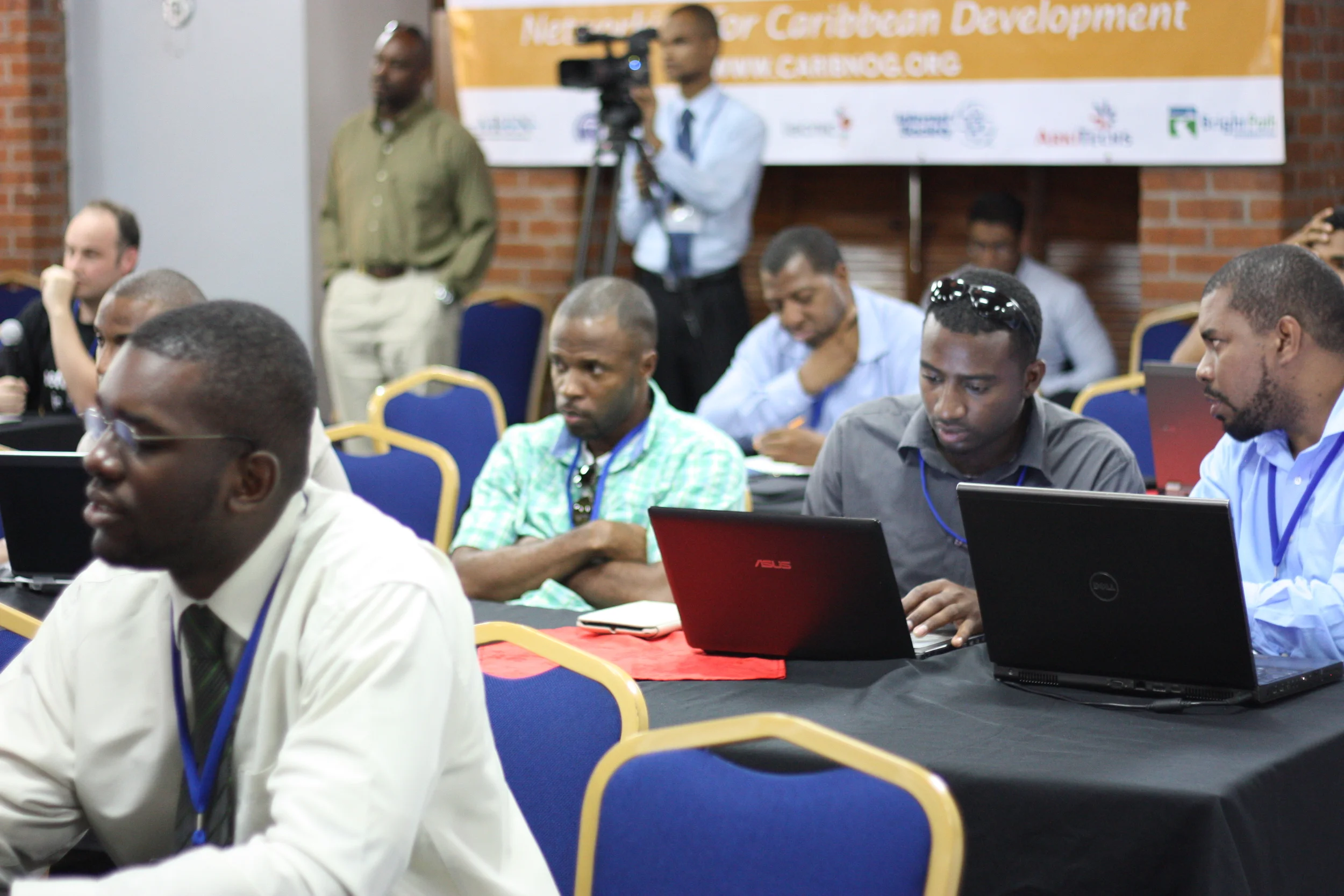 Audience members discussing panel’s points