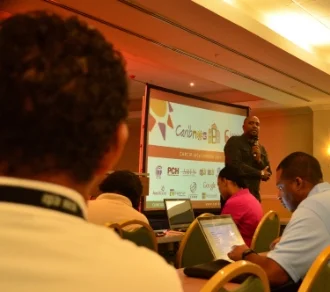 CAPTION: Junior Mc Intyre, head of Caribbean Telecommunications Union's Caribbean Regional Communications Infrastructure Program coordination unit, addresses regional tech experts during CaribNOG 8, Hilton Curacao, Willemstad, October 1. PHOTO: GERARD BEST