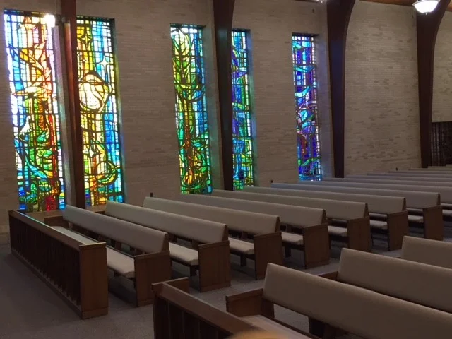 Stained glass 5 with pew at angle.jpg