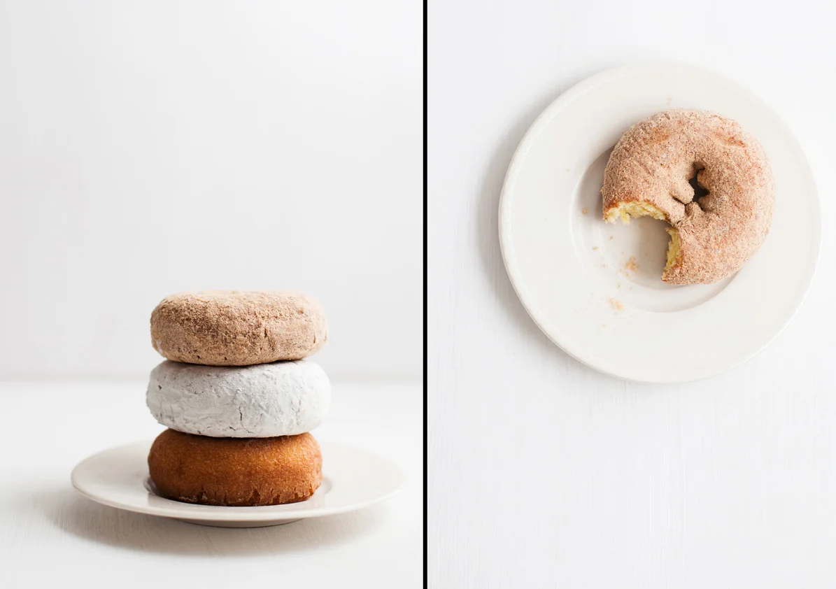 Three Winn Dixie Cake Doughnuts on Small White Plate with White Background.