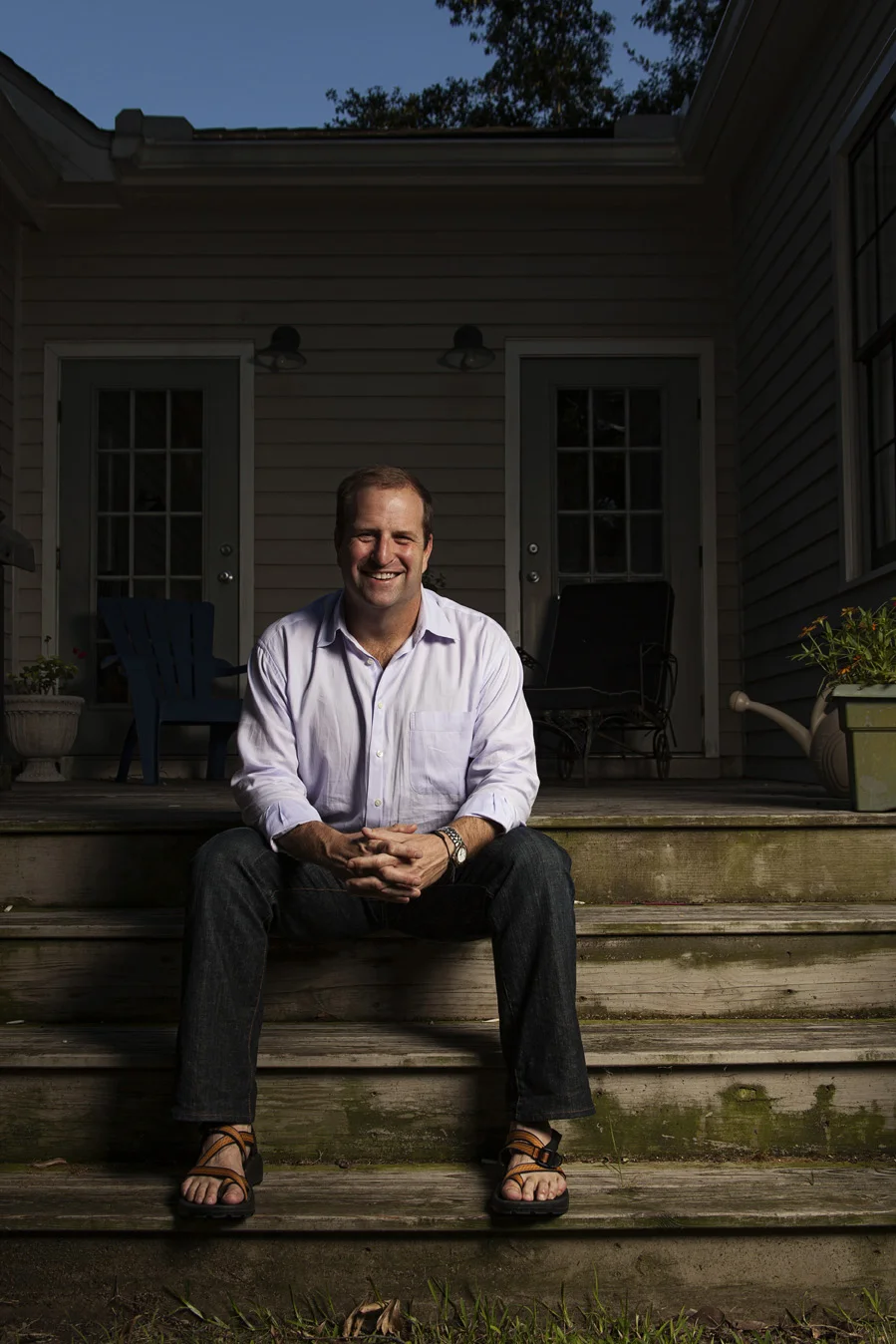 Kinnon sitting on the wood steps of his Midtown Mobile, AL home | Todd Douglas Photography