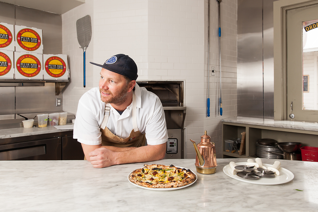 Chef Phillip McDonald near the pizza oven at Bud & Alley's Pizza Bar in Seaside, Florida.