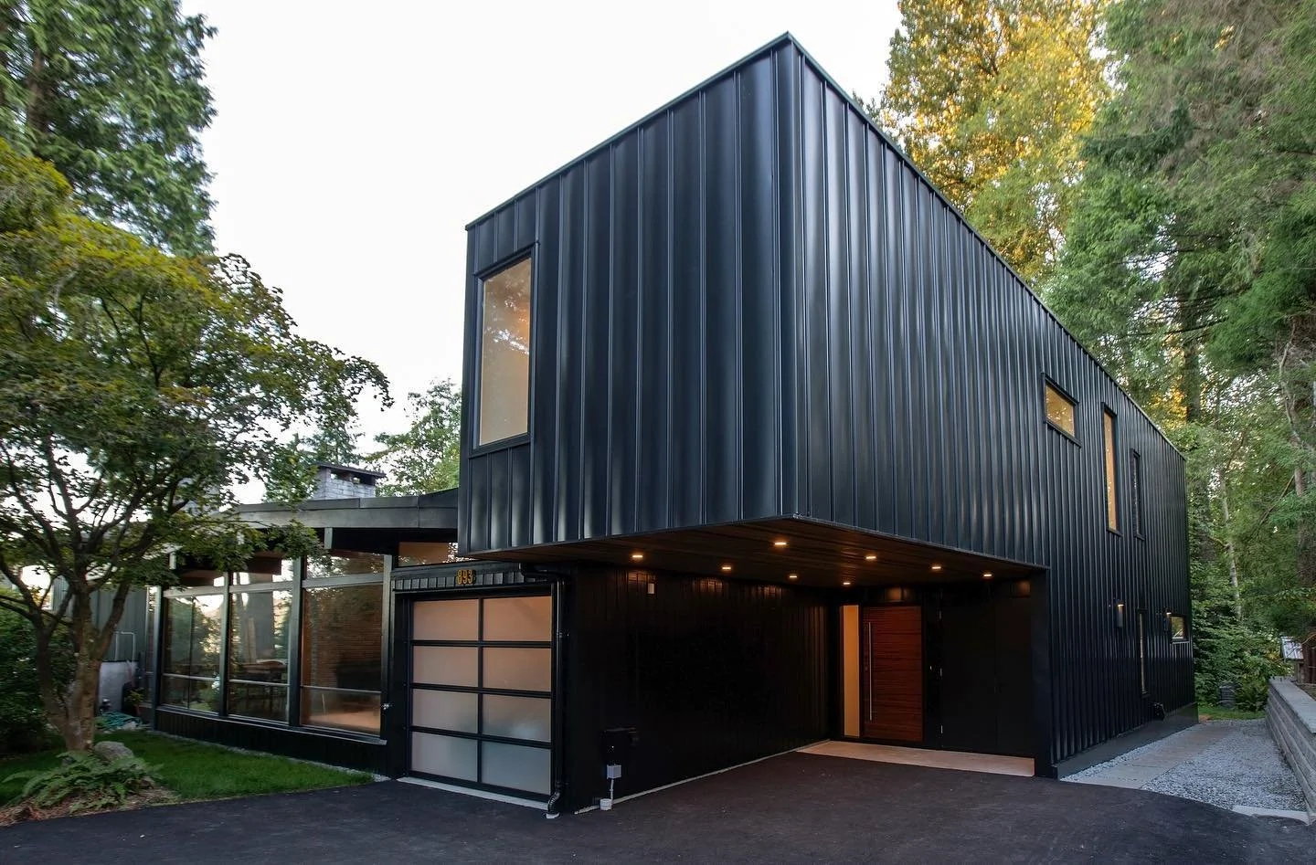 A before and after. Before this was a coast modern house with great bones for a family of five. The after was a renovation of the existing to make it shine and a contrasting addition to welcome grandparents moving in.

The bar addition respectfully c