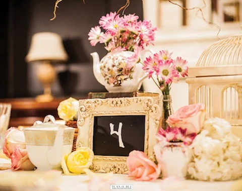 Vintage birdcage, tea pot and picture frame from Chicago Vintage Weddings