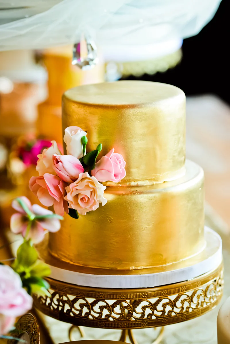 This gorgeous gold cake is a work of art by Elysia Root Cakes .