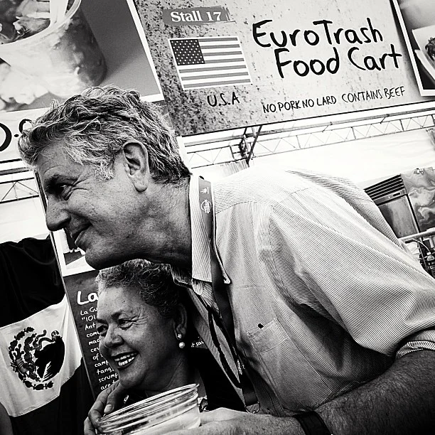 ^TOP: Anthony Bourdain with Sabina Bandera of La Guerrerense at WSFC 2013. Sabina is also titled "Ensenada’s queen of street seafood"! Image taken from @williamwongso's Instagram . Credits to the respective owner. >RIGHT: A little bit of La Guerrerense history on the stall. 
