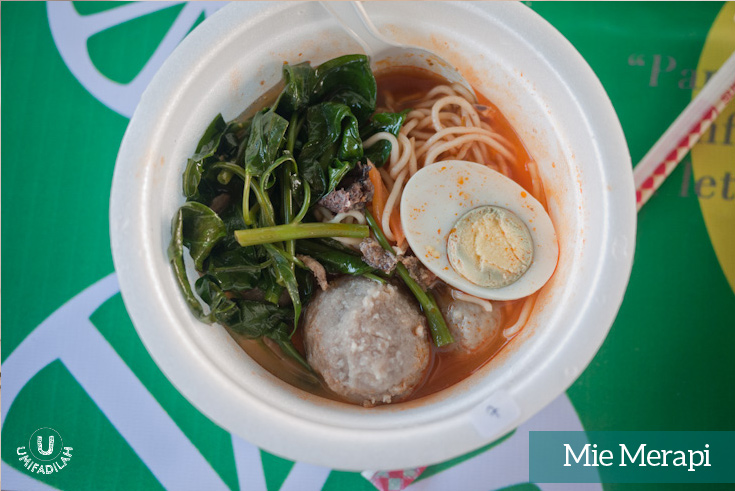 Mie Merapi Bakso . Wheat spicy noodles with meatballs and half hard-boiled egg.