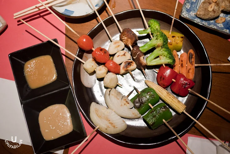 Assorted vegetable Kushiyaki called Yasai
Moriawase (IDR 60.000). Three-colored paprika, carrot, garlic, tomato, corn, taro, shitake, onion,
and broccoli. To me, it’s quite bland and needs to be charred a bit longer.
That’s where the sauce comes to the rescue. The two sauces above are Goma Sauce (sesame) and Miso Sauce (Japanese fermented bean paste) .