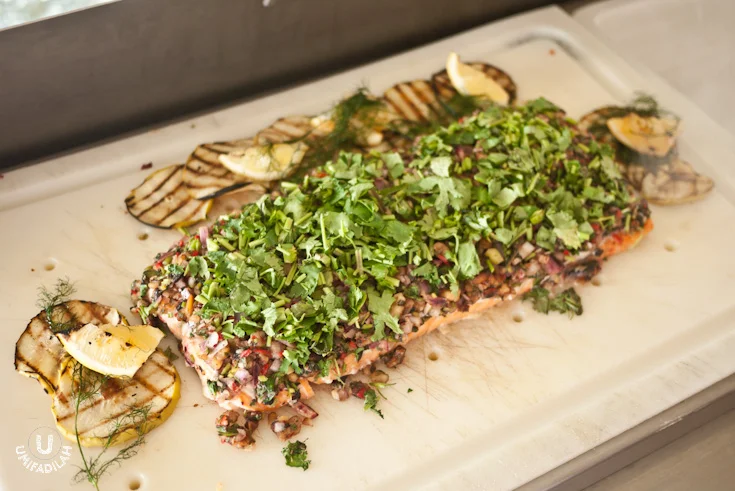 Baked salmon with mix salsa and herbs. 