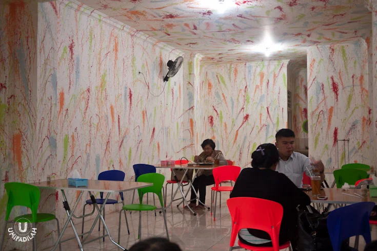 Funky interior; splashed wall-painting.