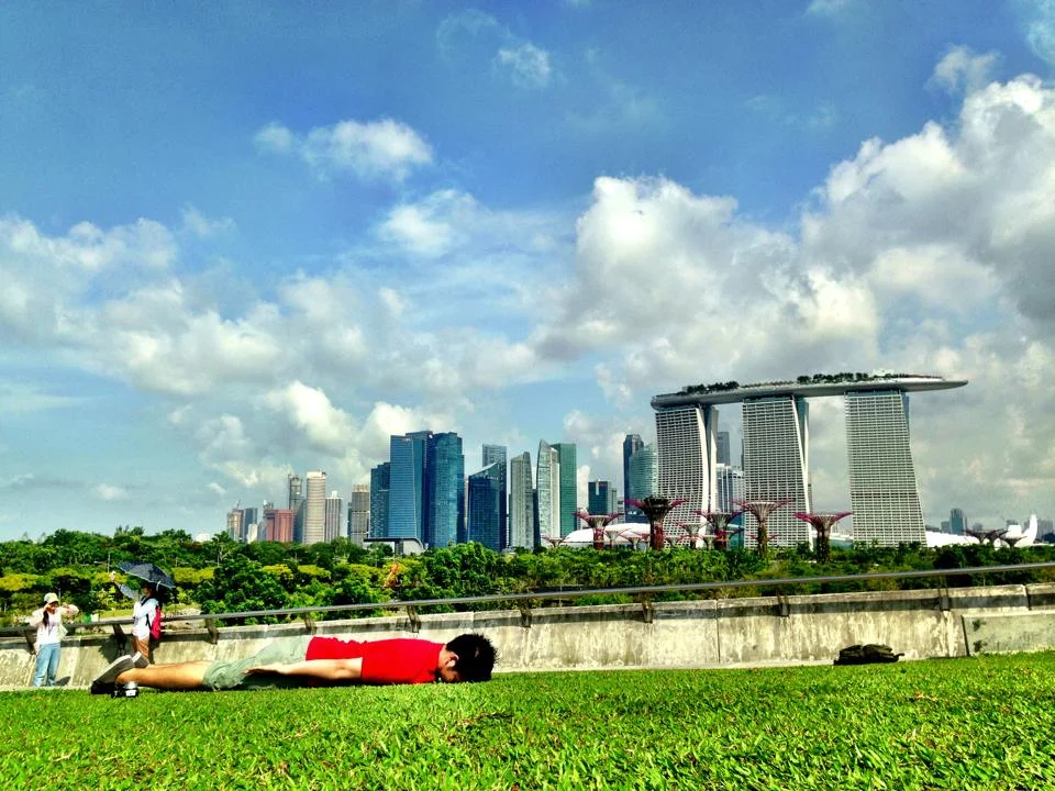 Somewhere in Singapore, with the background of blue sky and Marina Bay Sands.