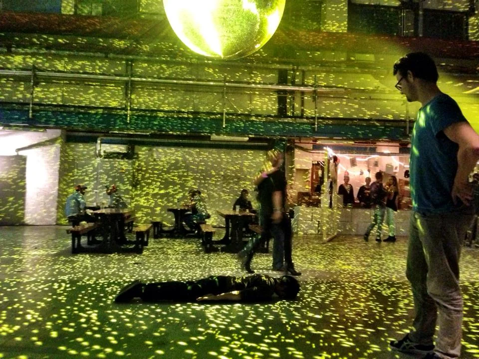 Under the shimmery lights of a disco ball.&nbsp;