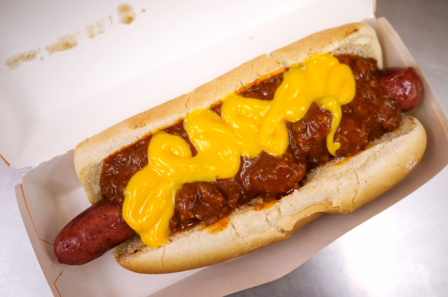 Chili Cheese Hot Dog ($4.79) . I'll say it up front: IT WAS A DISAPPOINTMENT. For most part, it was the chili & cheese that ruined the beautiful dog & bun, thus, ruining the whole experience. Here's a suggestion: Go get the Original ones ($3.99) - not only will you save money, but it's kind of the real deal. Do NOT ever get tempted to complicate the dish with chili that tasted like Tac* *ell's mushy-artificial-yuck-mixture; and cheese sauce that's actually not even using real cheese. After all, a really good classic hot dog needs ketchup + mustard and we're so ready to go! But if you really insist on adding topping, maybe try their Pepper & Onions Dog . A little bit of veggies can't hurt as bad as artificial chili cheese, right?