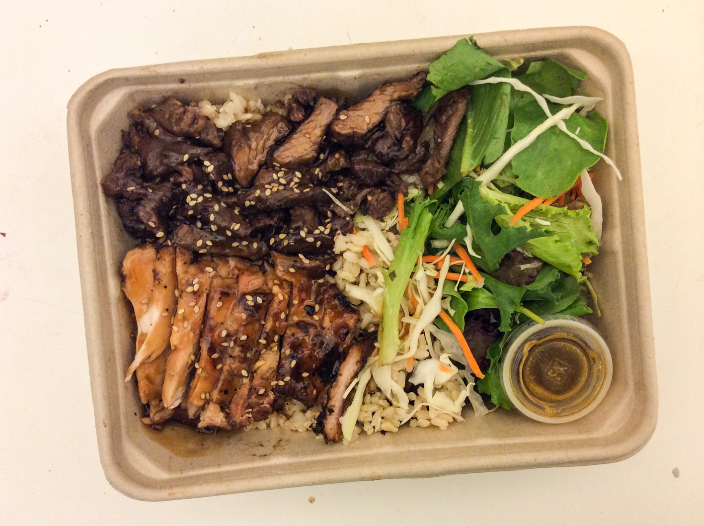 Combo! Hanger Steak & Chicken Breast Teriyaki with Brown Rice and Sesame Salad Dressing ($10). Yes, whenever you're feeling indecisive on what meat to have, opt for this Combo Package instead! Their Hanger Steak (which is marinated Japanese beef BBQ) wasn't dry at all, in fact it was as juicy as their grilled chicken. This was actually my first purchase on my first visit to Glaze Teriyaki, and this is what kept me coming back.