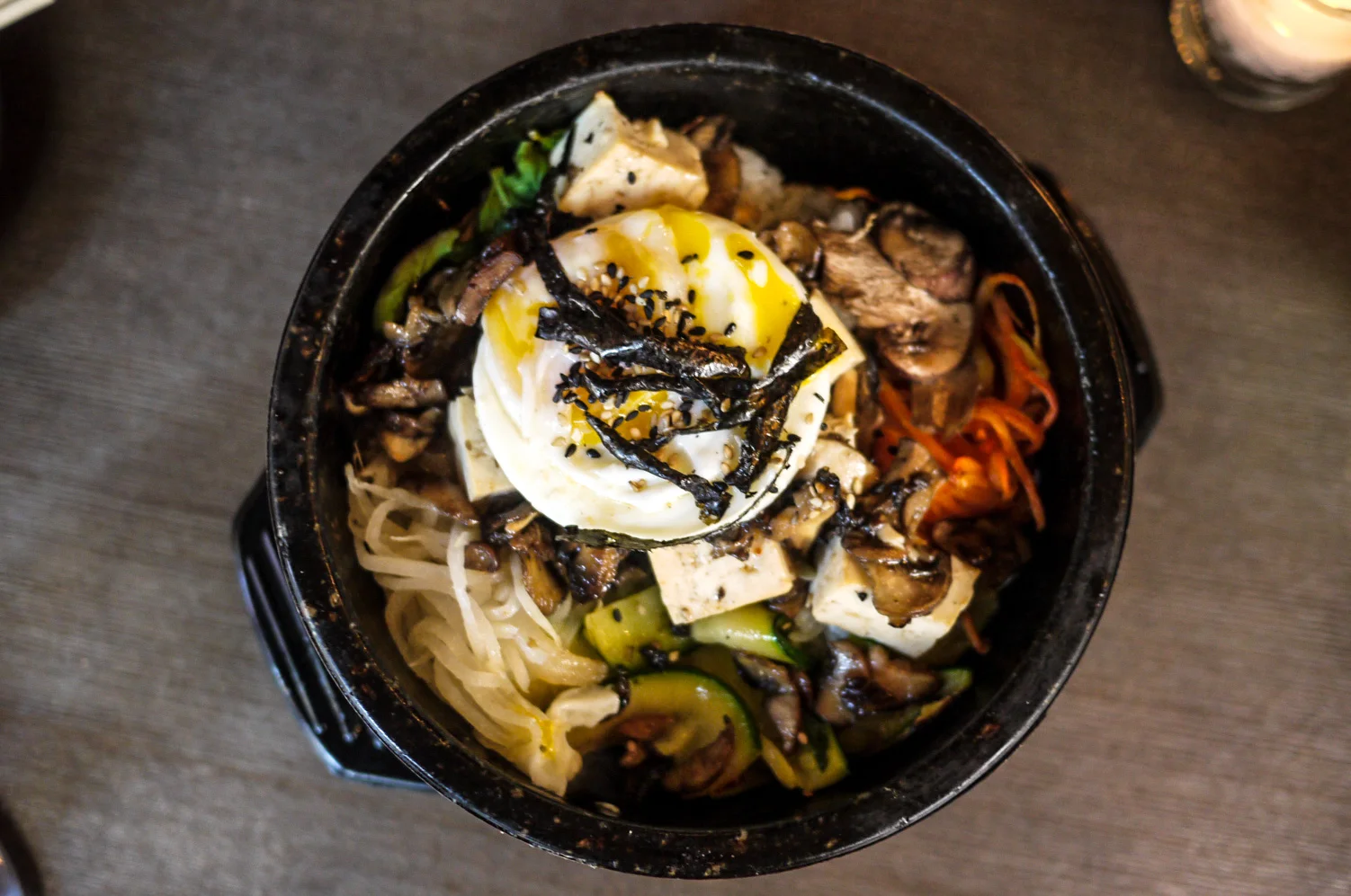 Tofu & Mushroom Jr Bibimbap ($10) - Kimchi, farmer's greens, sunny side up egg, seaweed. The vegetables were fresh, but they kinda ruined the fun when I found out that the egg yolk is already tore apart. It should be our right to break them apart and mix the whole bowl, don't you think? Haha. But what really bring the dish to a maximum tasty level is the sauce (made of Gochujang). I didn't have it on photos but I swear it's what make the dish 'alive'.