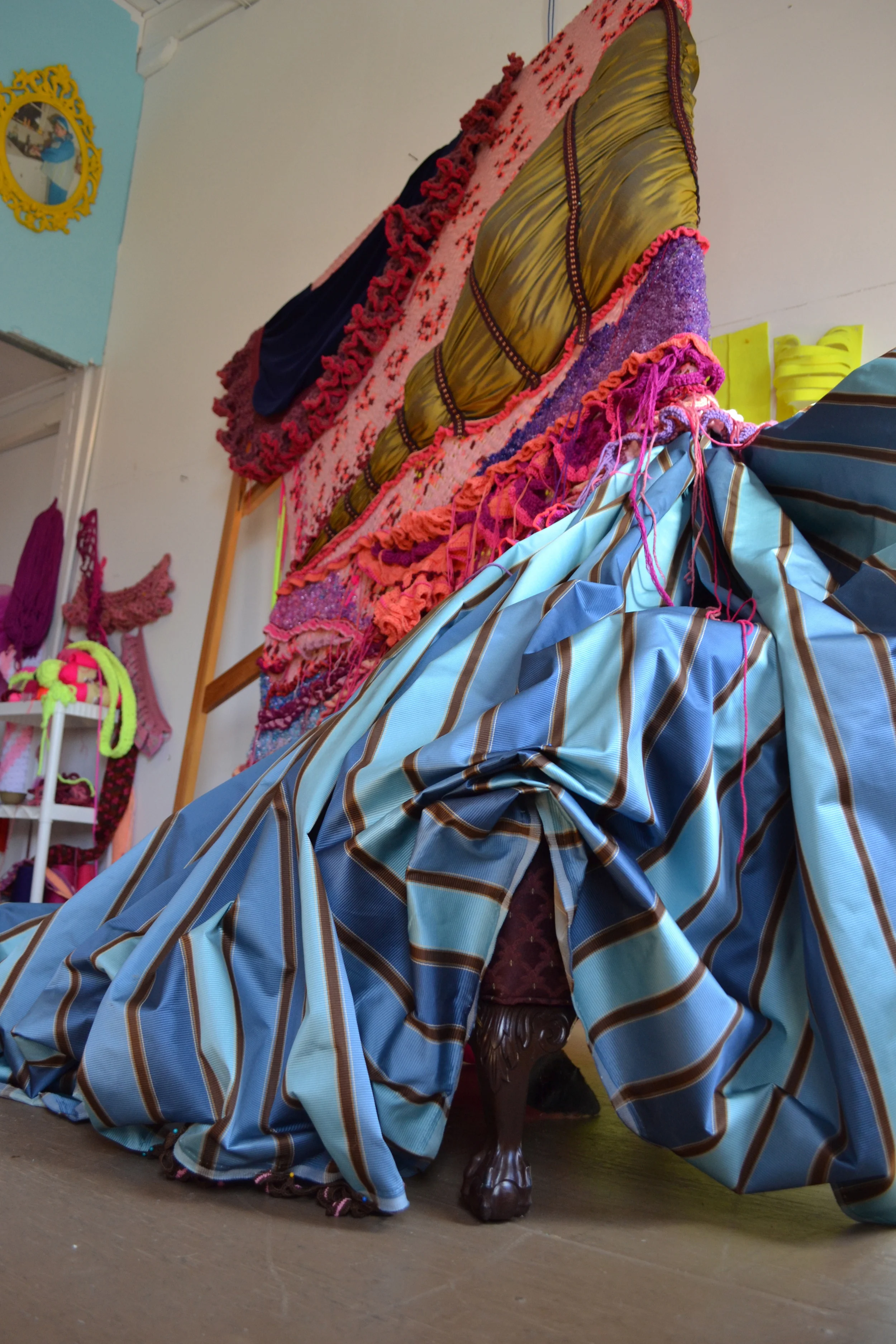 "lady of leisure" in progress, app.13hx10'wx6'd, recovered afghans, beads, acrylic yarn, fabric, stretcher frames, sequins