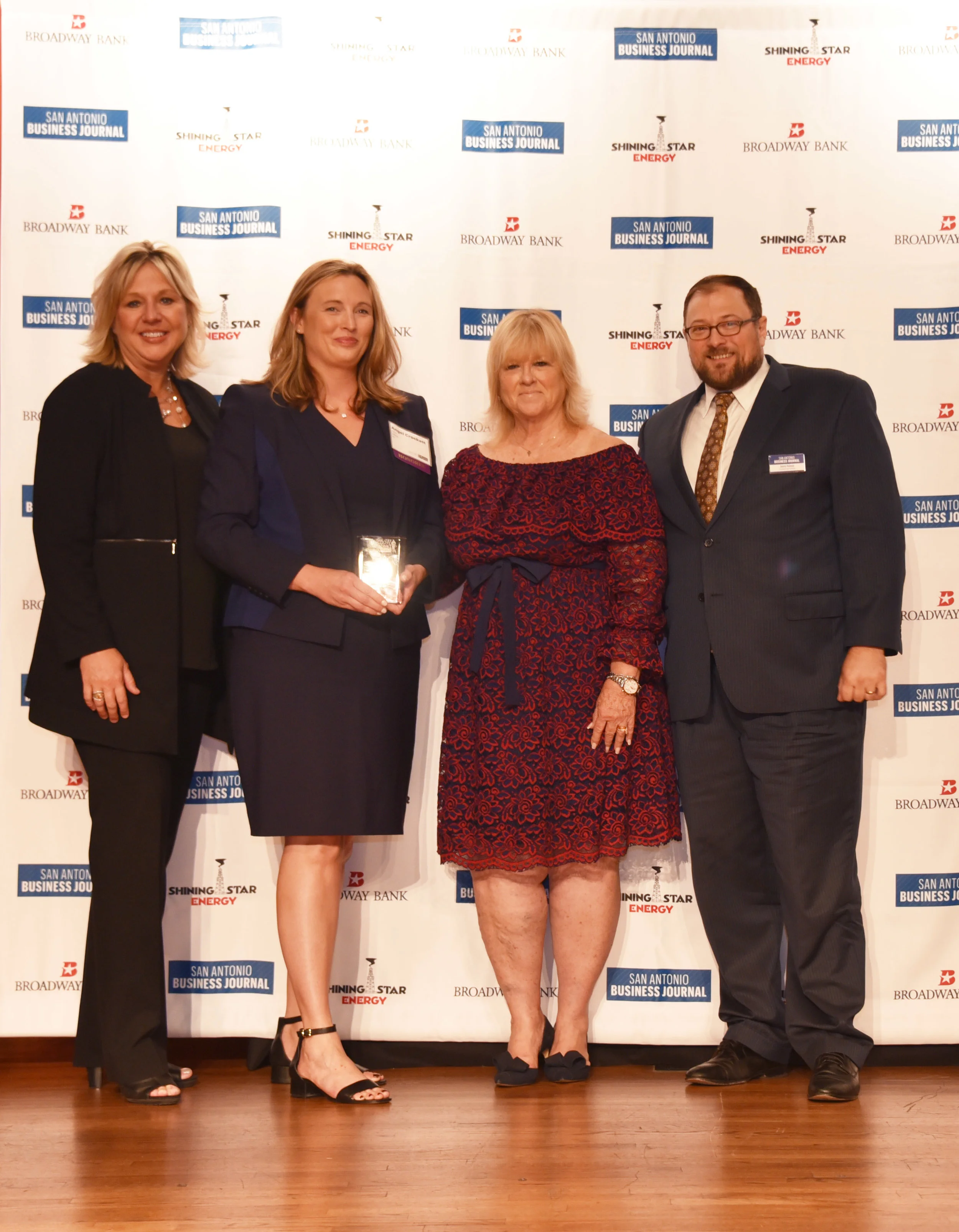 Angel Crockett receives her San Antonio Business Journal Women's Leadership Award as an Honoree.