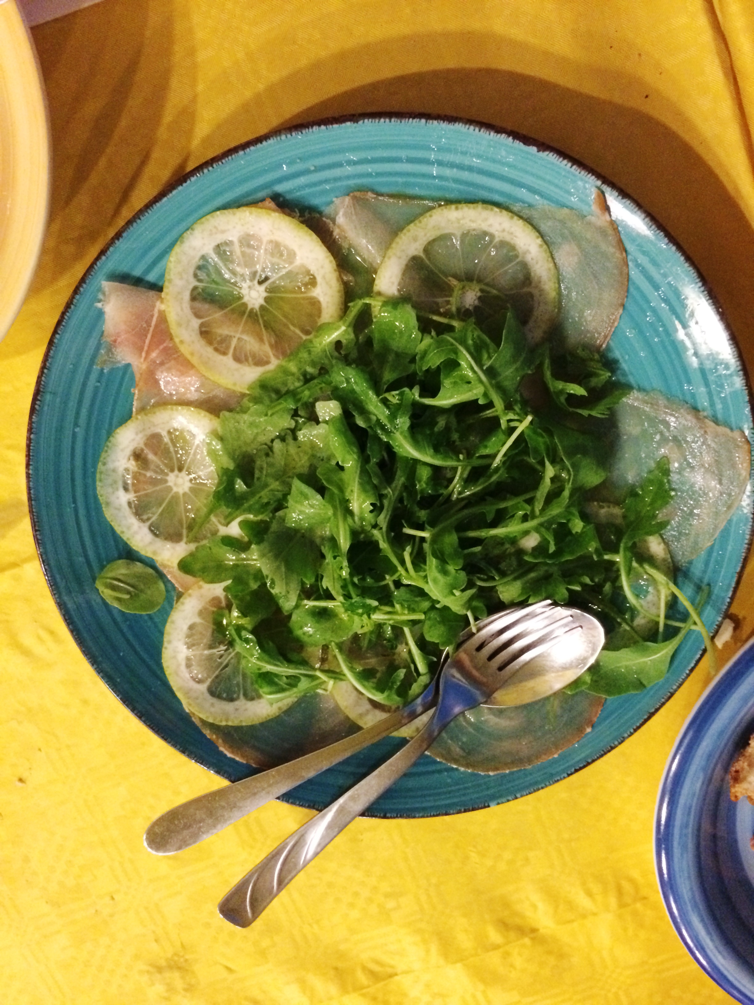 raw swordfish with lime and arugula