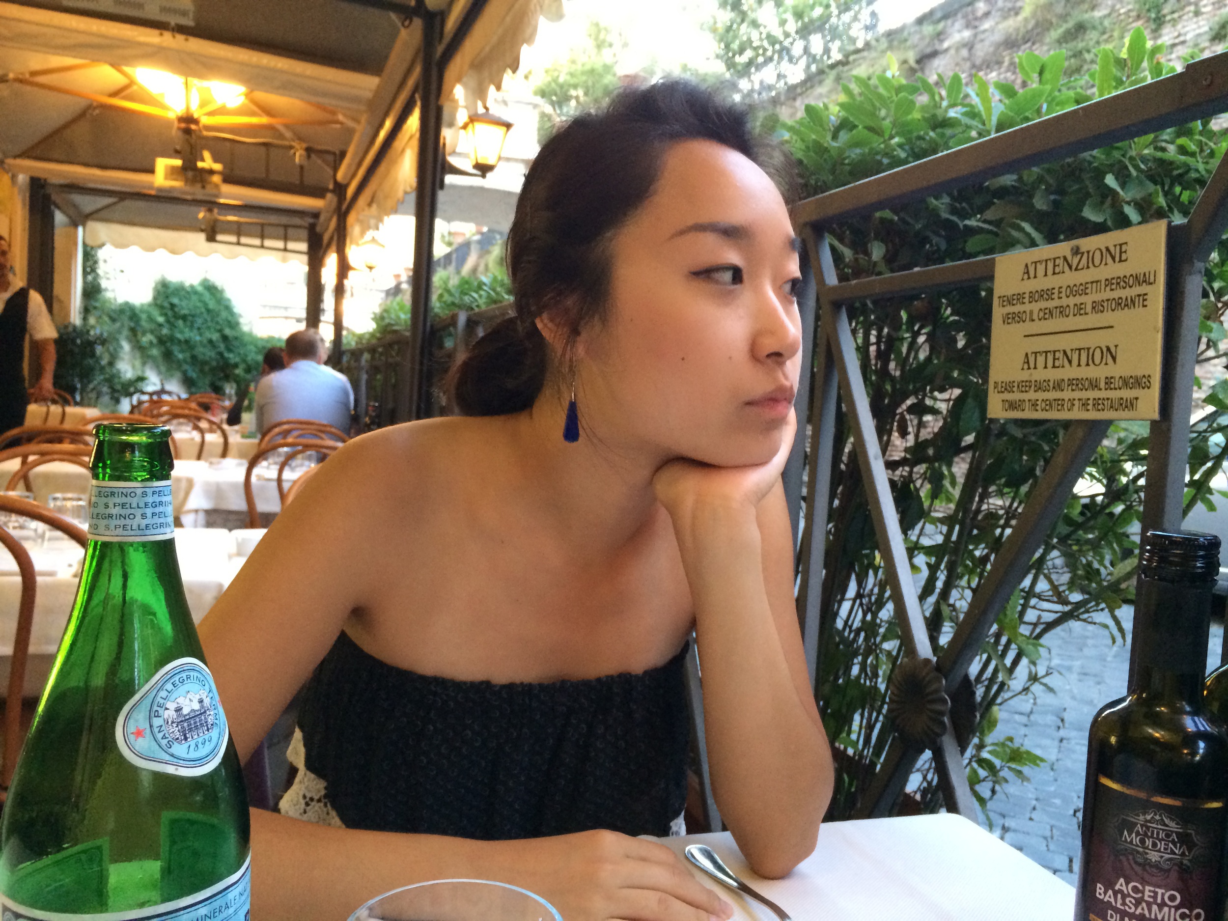 Notice the sign I'm looking at. "Please keep bags and personal belongings toward the center of the restaurant." I think this means your bags will probably get stolen if you put them near the fence, believe it or not.