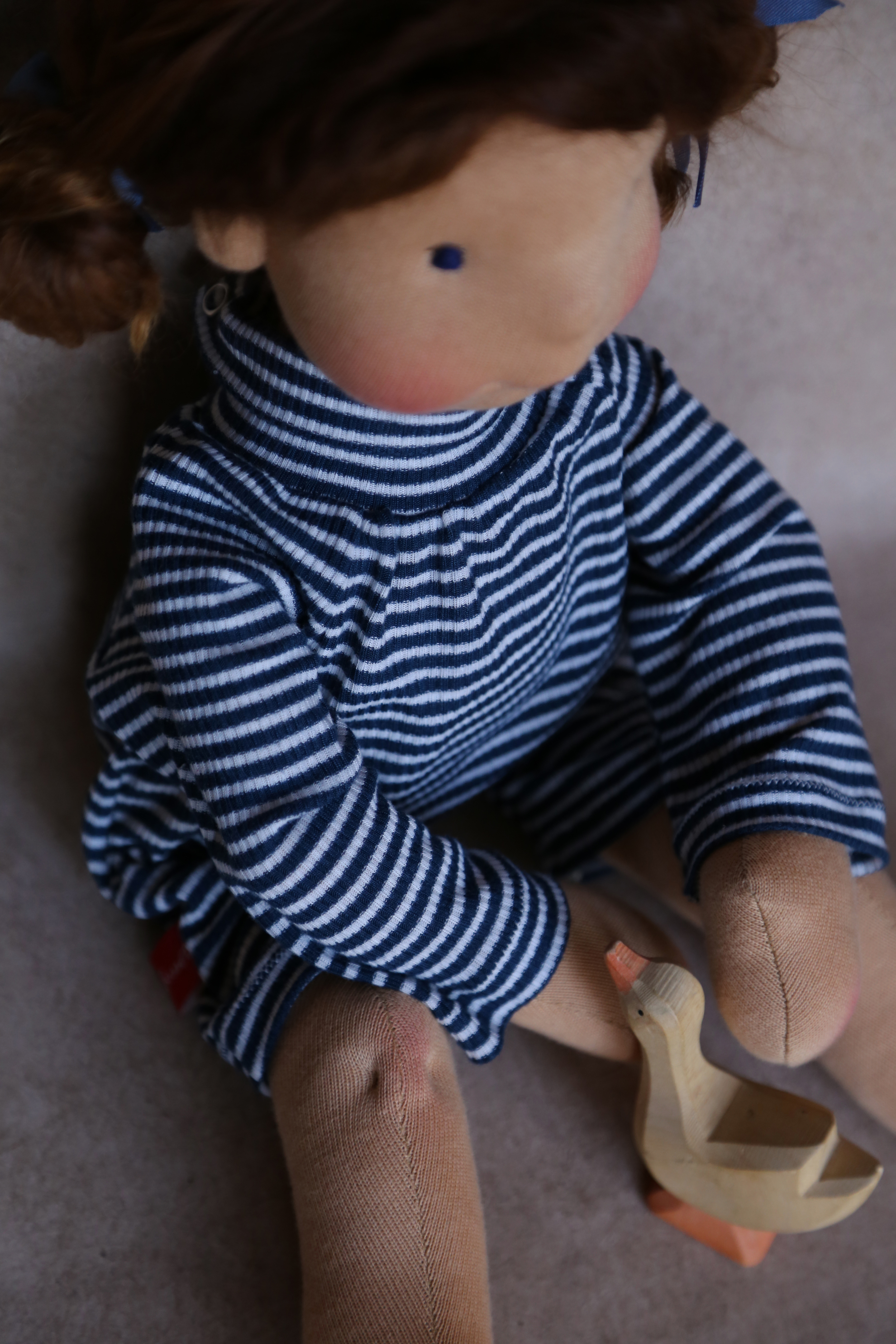 Maëlle in a striped body suit, by Petit Gosset