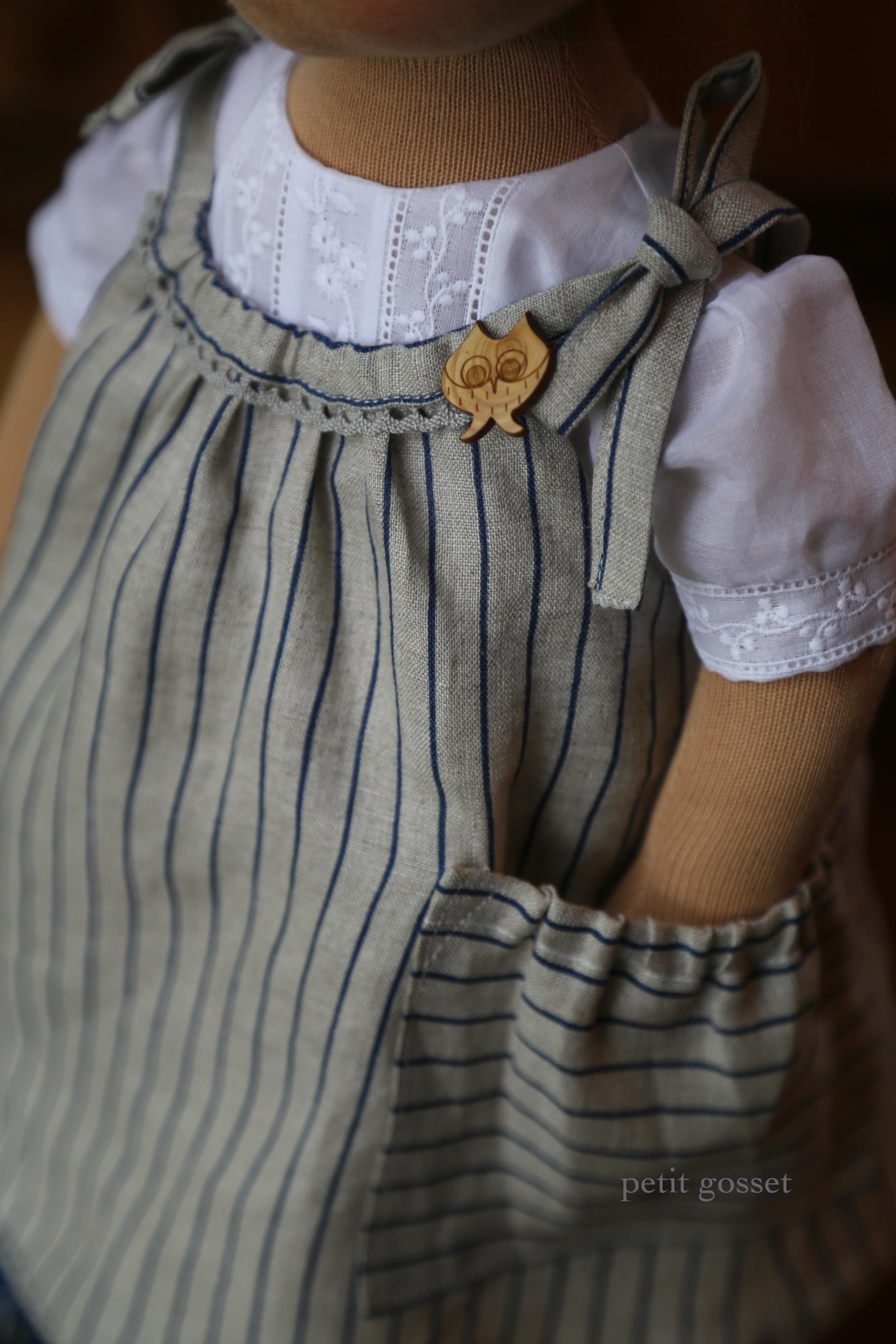 A linen pinafore with a pocket