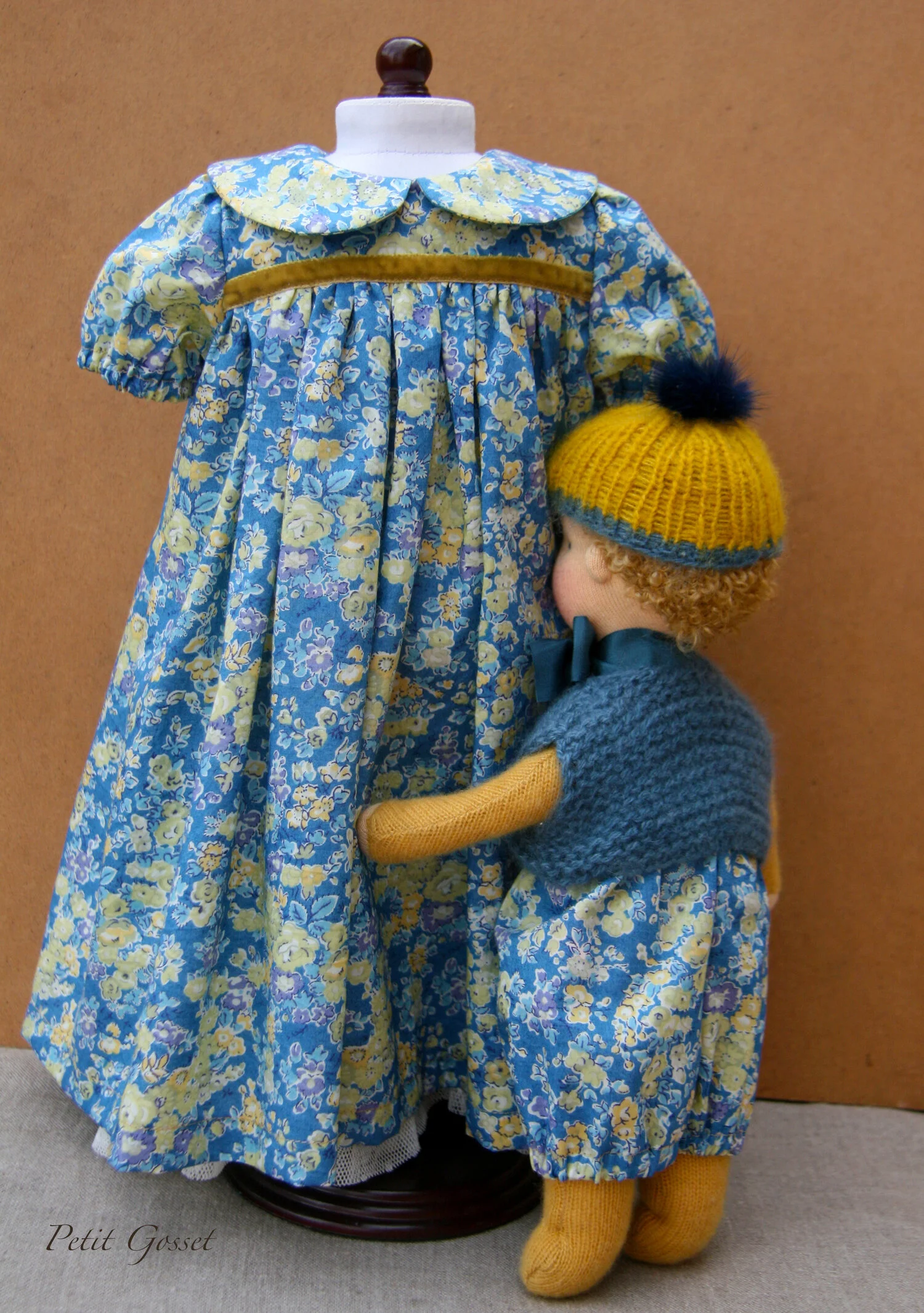 Little Léo with a dress for his beloved sister