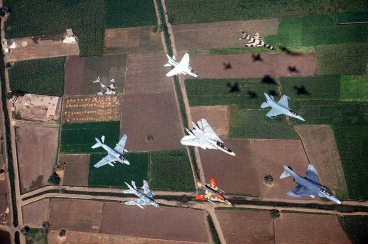     Front clockwise, F-4 Phantom, French Mirage 2000, Mig 19 Farmer , A-6 Intruder, Mig 15, A-7 Corsair, Mig 21 Fishbed, F-16 Falcon &amp; Middle is F-14 Tom Cat.    