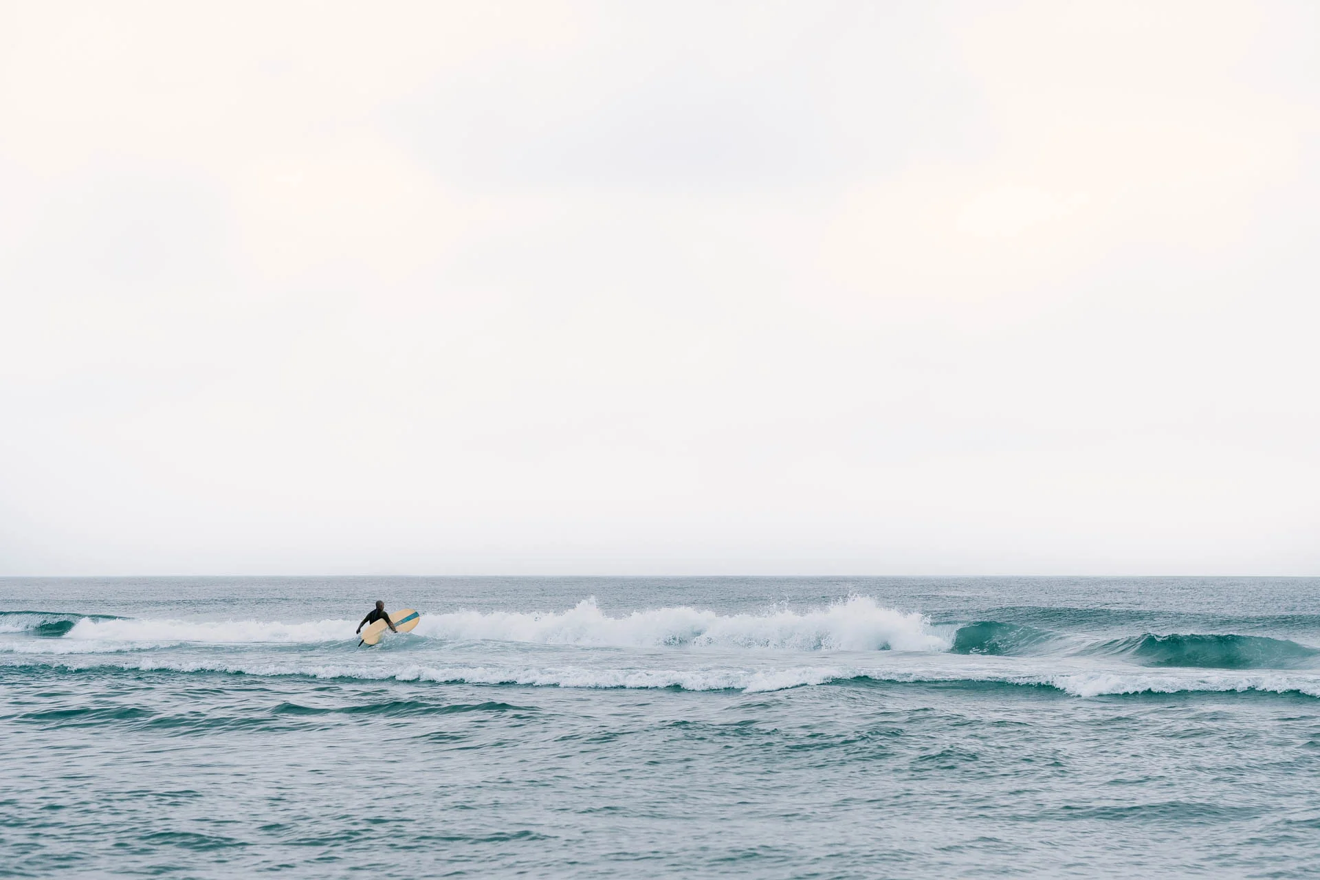 Surfer at Beach Haven Shore