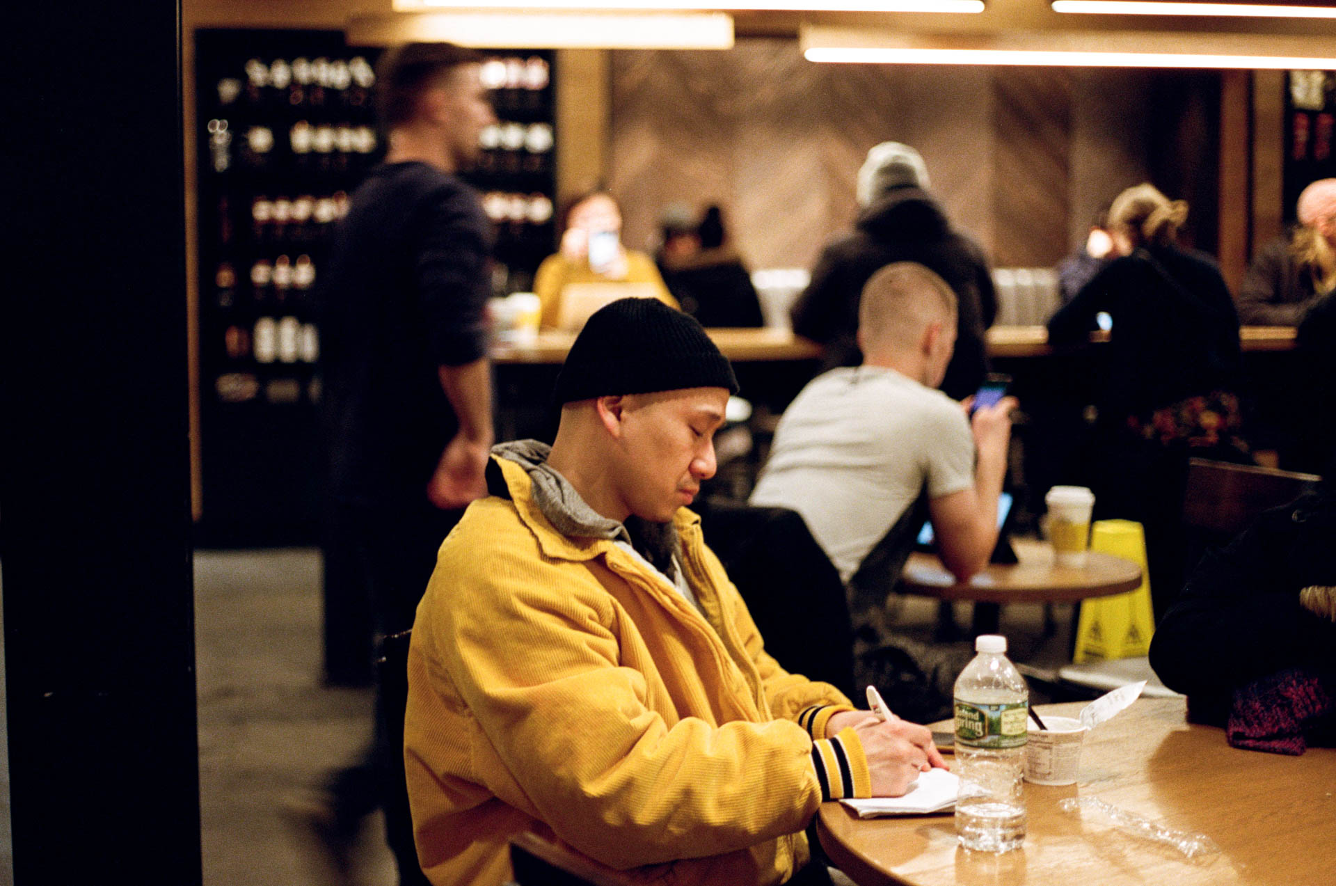 Man in Yellow Jacket at Starbucks