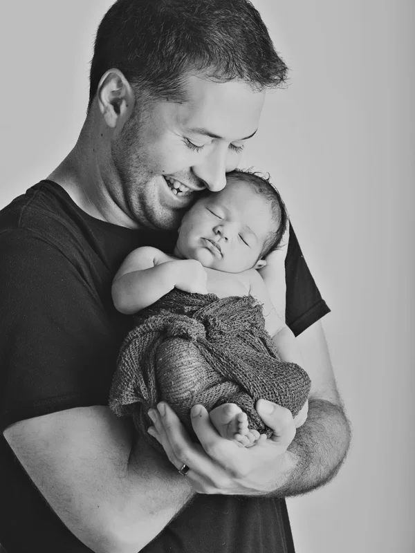 happy dad with newborn daughter