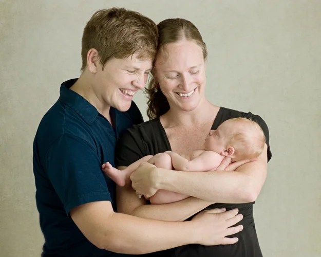 artistic family portrait with newborn baby