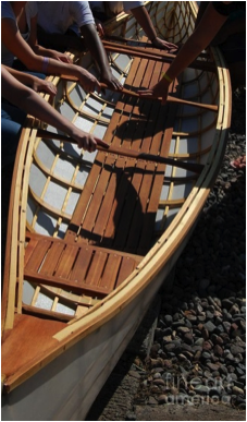 A boat and the hands that built it at Pines school in 2012.