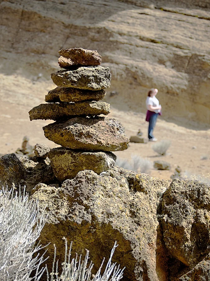 A bit on the whimsical side, at the center of Fort Rock, there are dozens of rock stacks. The abundance of loose rocks invite you to build yet another stack, or improve on an existing one.