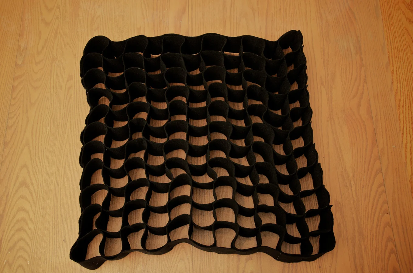 Completed DIY softbox grid made from cloth strips.
