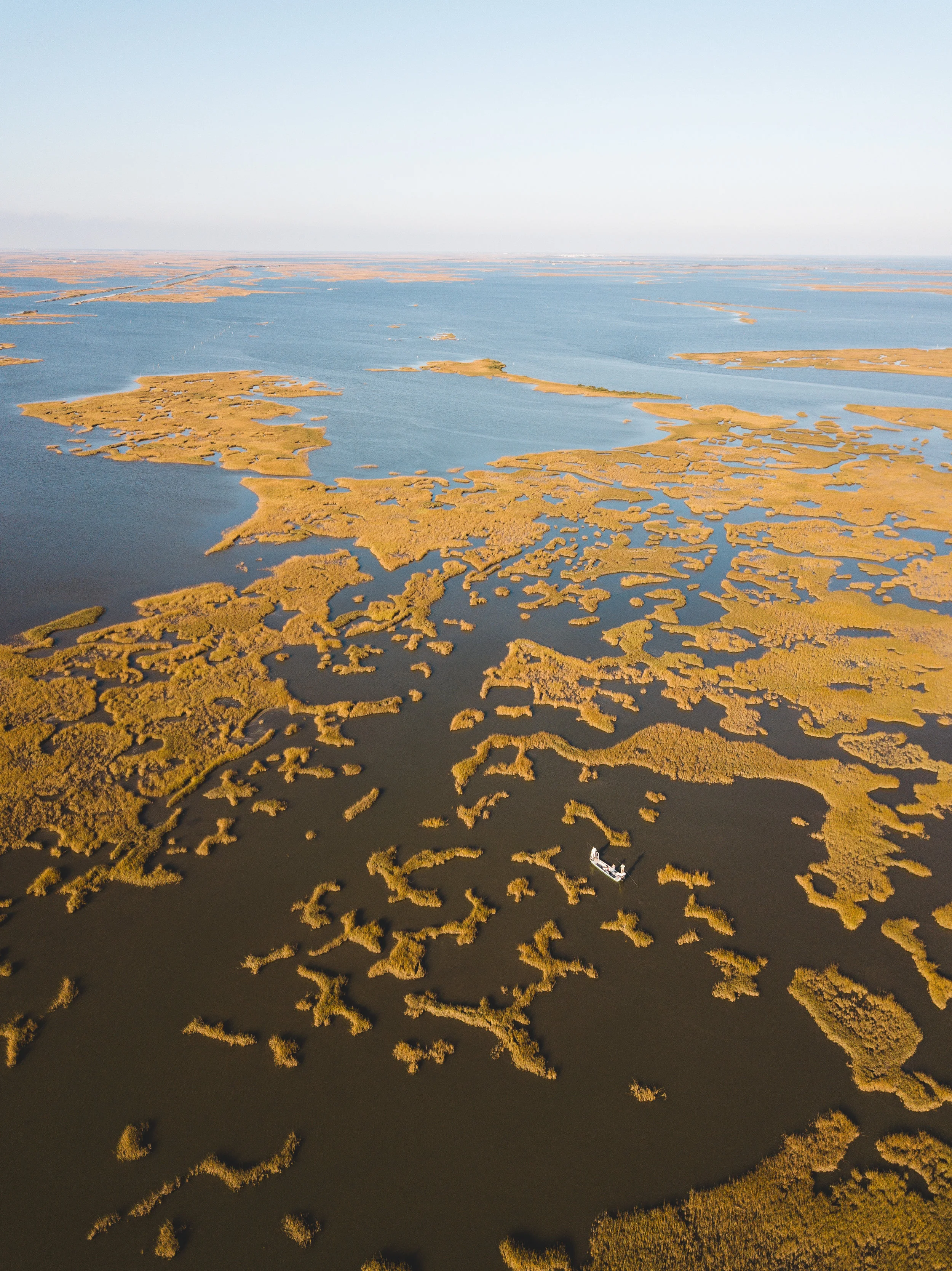 Ben, Bill and myself poling through an endless maze of marsh.&nbsp;