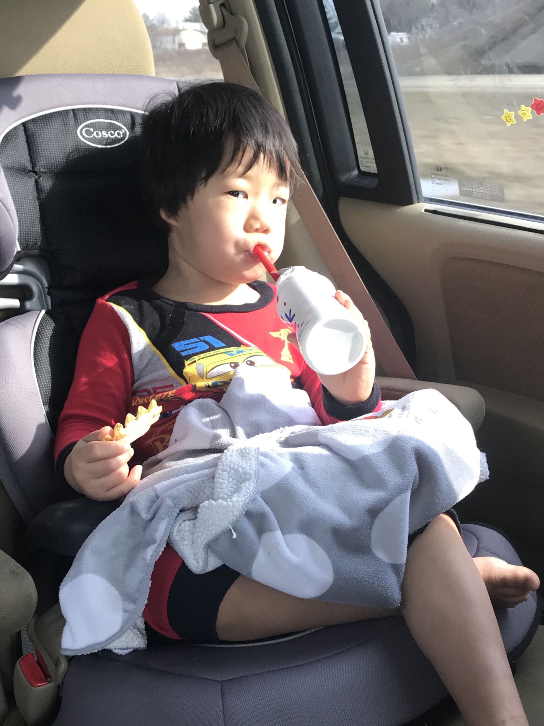 Enjoying his post-op Chick-Fil-A. He requested "BIG fries." The surgery went quite a bit longer than expected so we were hustling back to meet the kids. He was pretty sleepy yet. 
