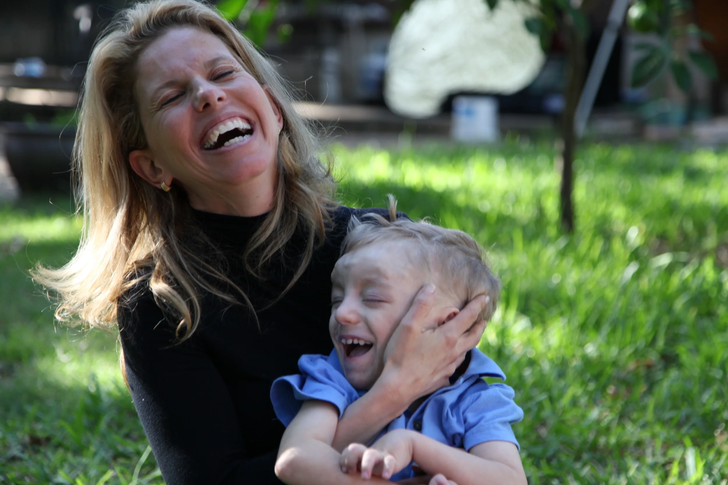 Both undiagnosed, Dr. Moritz & 5 yr old Jeremy sharing a joyful moment after his family interview
