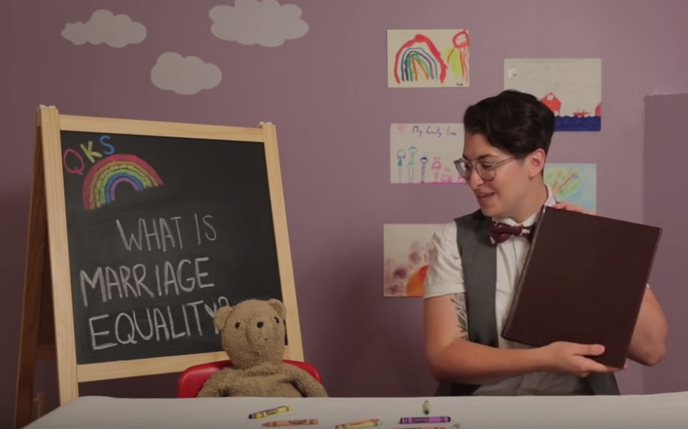 Checking out the the family photo album with Teddy and Lindsay. (Screencap via YouTube ). 