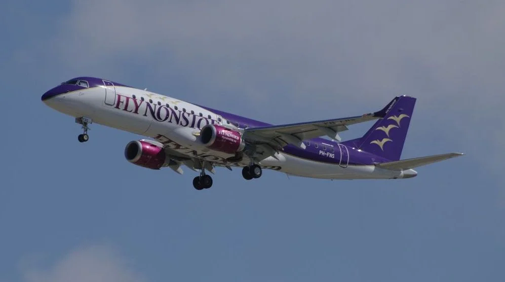 A Flynonstop Embraer E190 landing at Barcelona airport