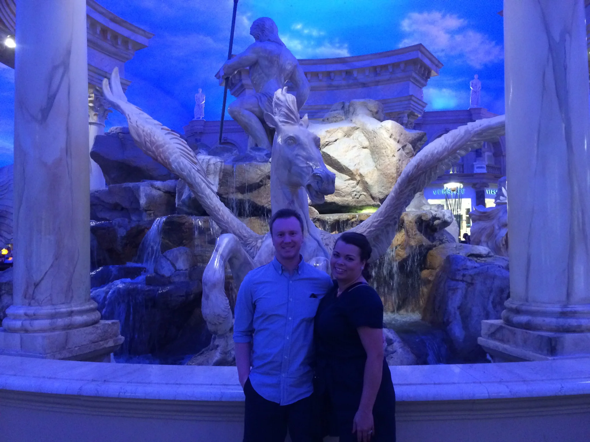 Jason and Ashley by a statue in the Shoppes at Caesar's Palace.
