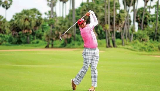 Indian golfer Amish Jaitha hits a shot off the fairway on his way to winning the Angkor Amateur Open at the Angkor Golf Resort in Siem Reap yesterday. Photo Supplied