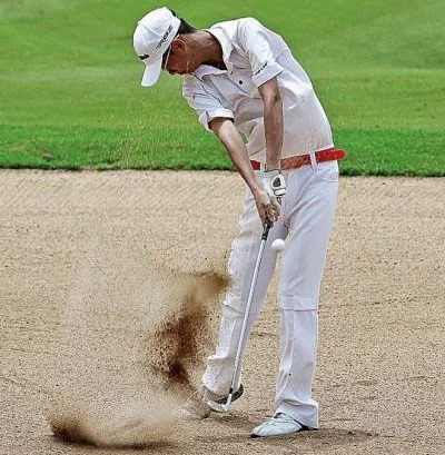 Sim You Wei of Malaysia hits a bunker shot during the Cambodian leg of the 2012 Faldo Series at the Angkor Golf Resort in Siem Reap. Photo: Sreng Meng Srun