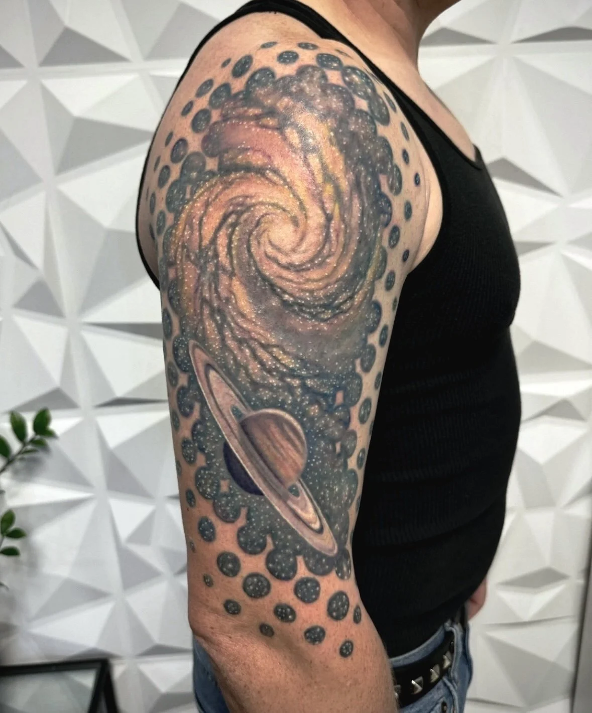 Black and grey galaxy half sleeve tattoo on the arm, Austin, by Andrew Matela